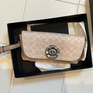 Coach case for sunglasses.